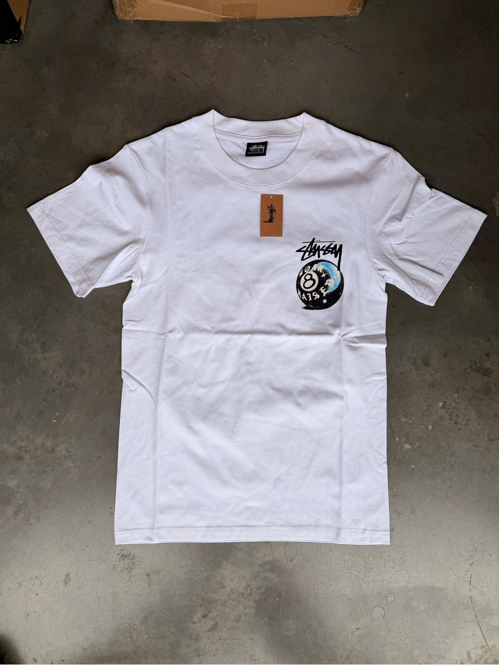 Stussy White Crewneck T-Shirt with Small Black & Blue Pocket Graphic